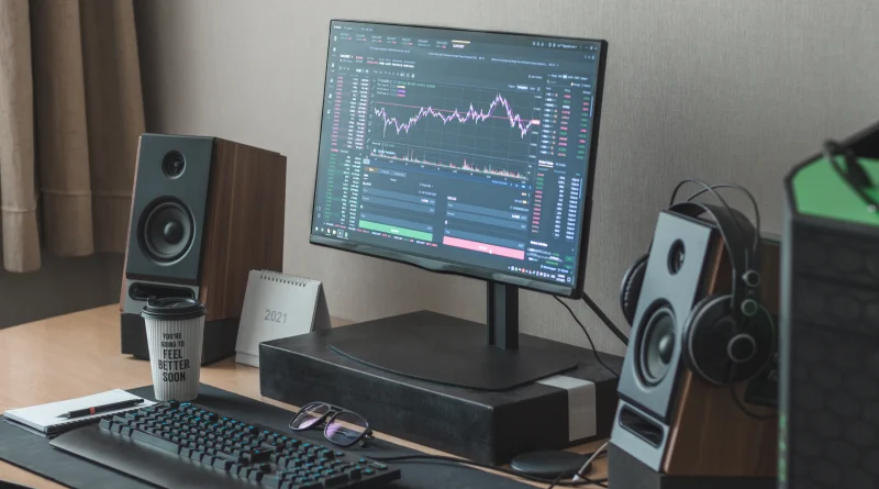 Trilby News; Crypto, Bloc, Web3, DeFi Meme Stock Mania Image shows computer with stocks charting